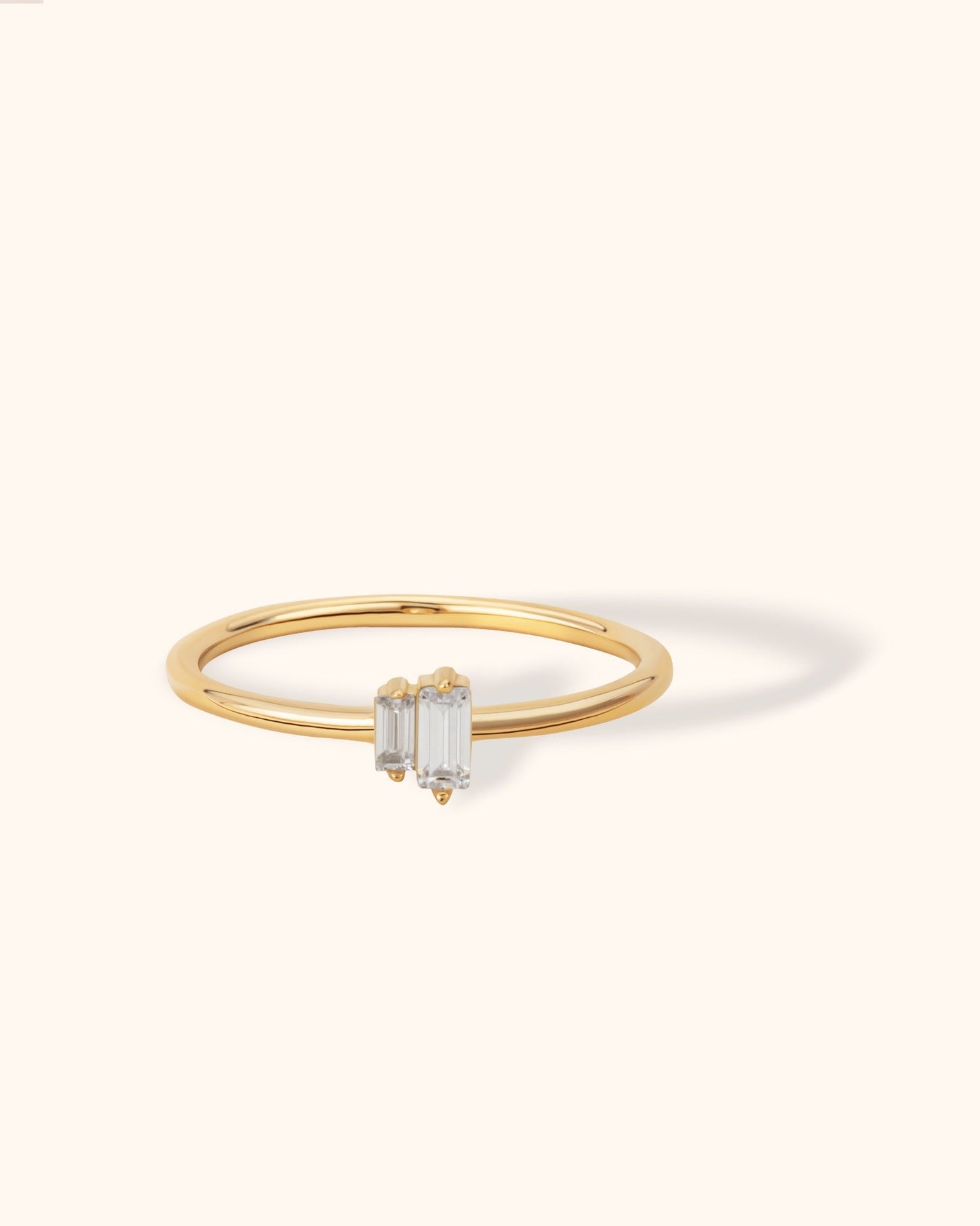 14K gold ring with two vertical baguette-cut diamonds in a minimalist open design